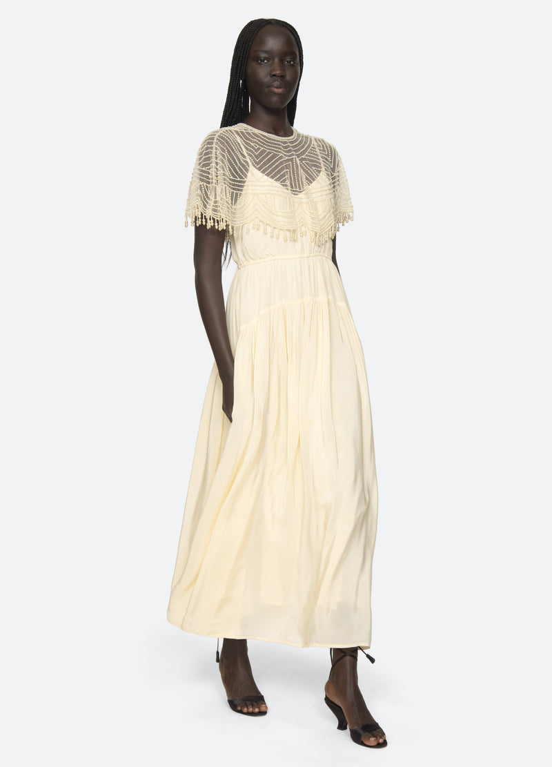 cream-carlotta dress-walking view - 8