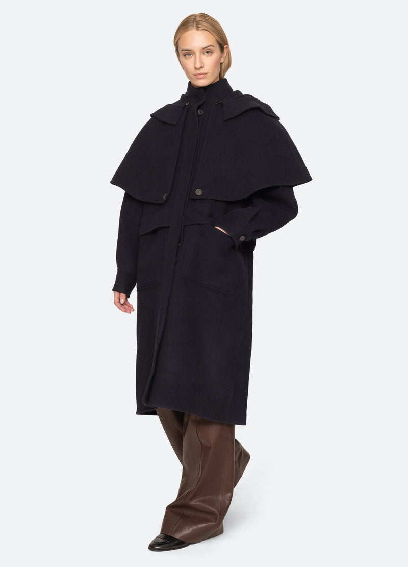 navy-lona coat-walking view - 6